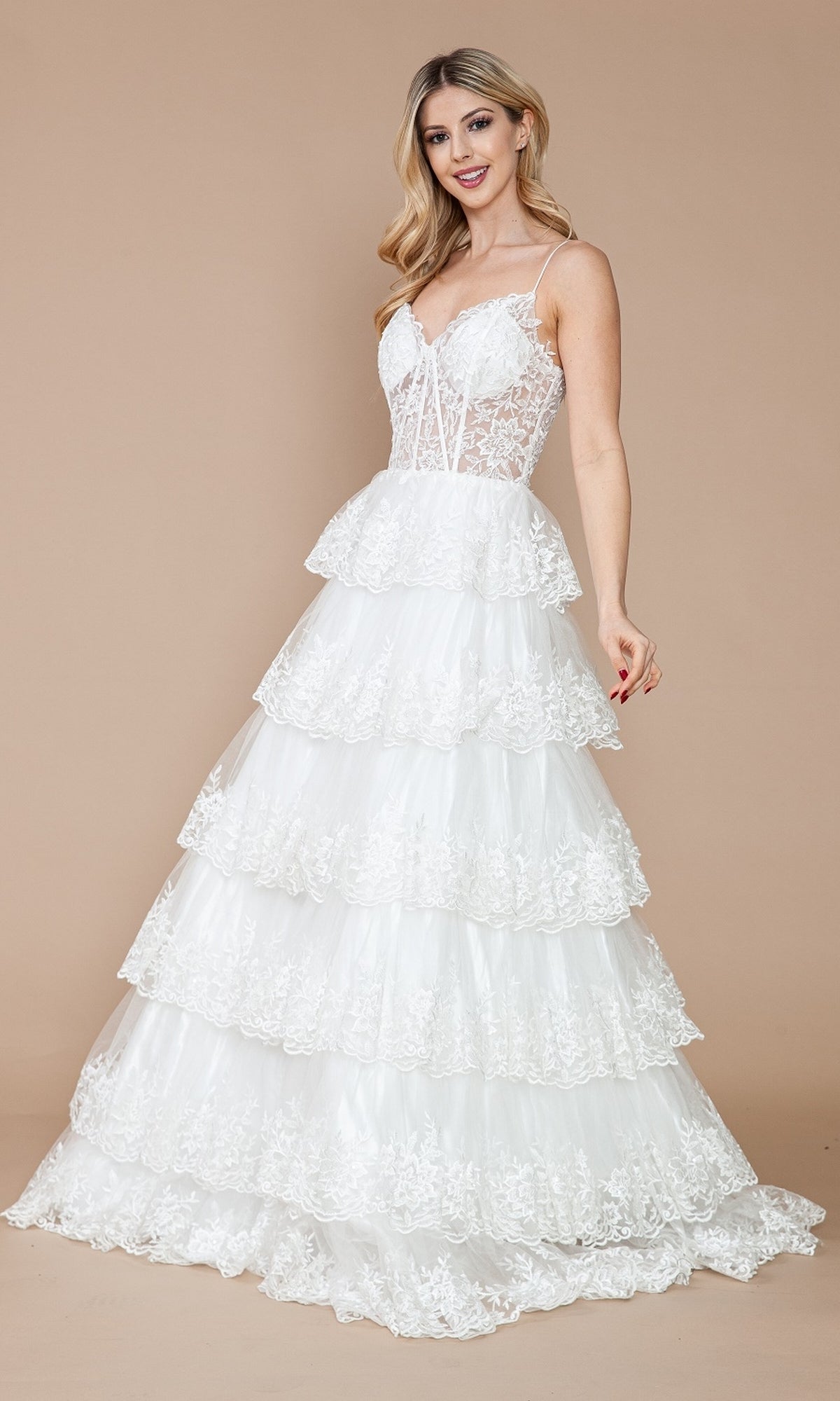 A woman wears the Sheer-Bodice Long Ruffle Prom Ball Gown: Poly 9402, featuring an embroidered lace bodice and thin straps, standing against a plain beige background.
